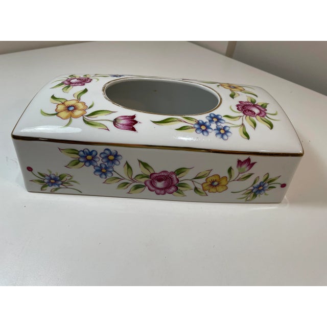 Beautiful vintage hand-painted German porcelain tissue box cover featuring delicate floral decoration and gold trim. A...