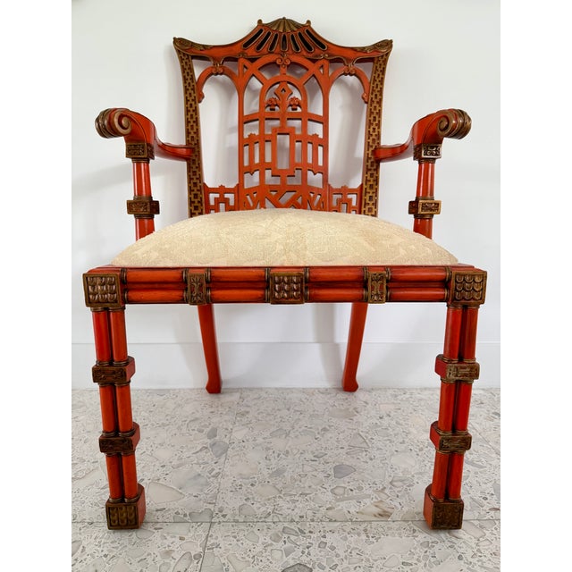 This is a George III style red and gilt Japanned armchair featuring a pagoda-shaped crest rail. Designed and hand made in...