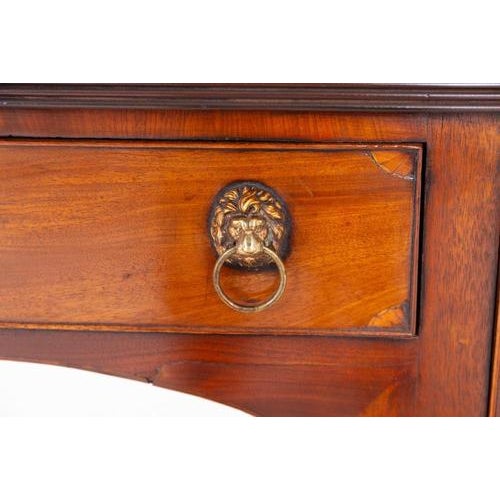 A handsome Georgian mahogany sideboard of classic form and elegant proportions, raised on finely turned ring-turned legs...