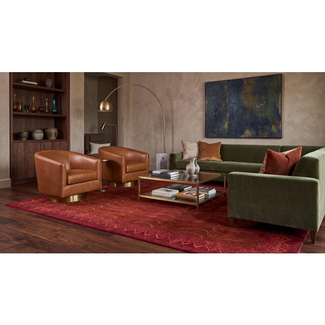 An exceptional statement piece for luxury interiors, this hand-knotted modern Tibetan rug pairs a rich crimson hue with...