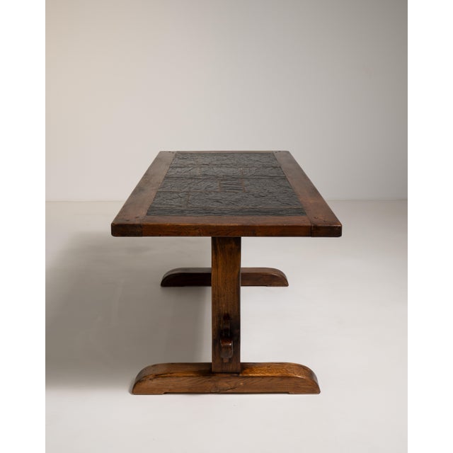 A supremely refined example of French design from the early 1970s, this oak dining table pairs the warmth of richly...