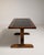 A supremely refined example of French design from the early 1970s, this oak dining table pairs the warmth of richly...