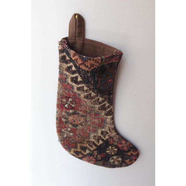 Celebrate the season with this one-of a kind Christmas stocking, handcrafted from a genuine antique tribal rug. Rich in...