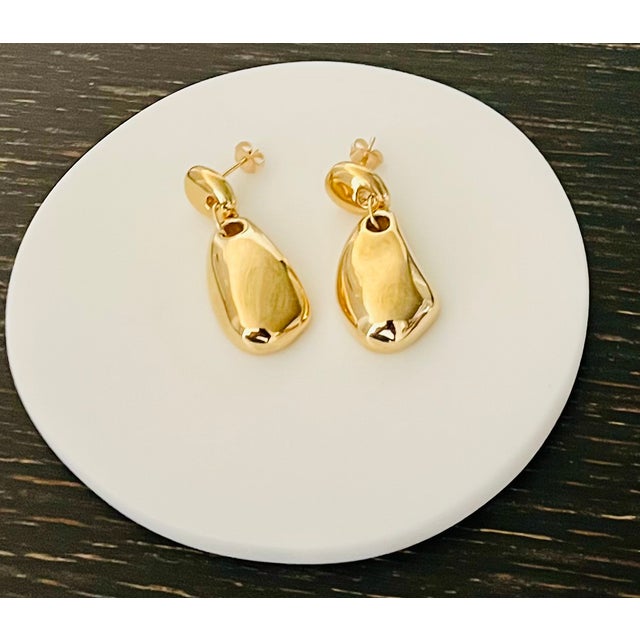 A refined example of modern American jewelry design, these AGMES sculptural earrings are handcrafted in New York and...
