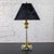 Stunning vintage Neoclassic Revival candlestick table lamp composed of Lucite with brass details, 3-way switch, and square...