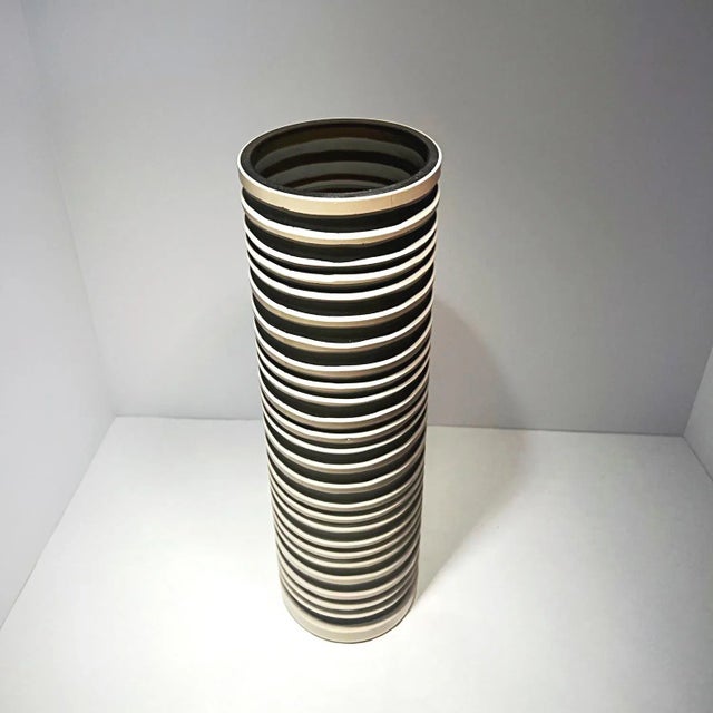 Beautiful Vessel Vase by Viterra Art Glass, measures 16H x 5W x 5D inches. This vase is of the Viterra Gallery Collection,...