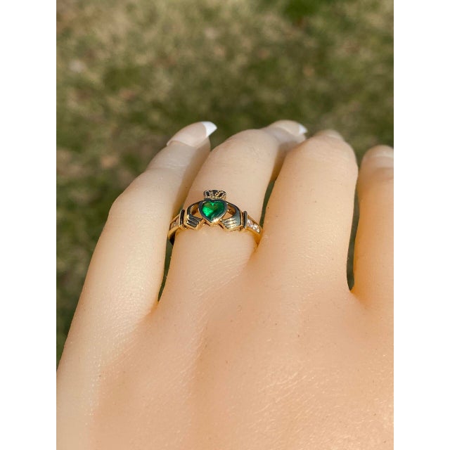 The Bantry: Irish Made Designer Signed Lab Emerald and Cubic Zirconia Claddagh Ring. This exquisite ring showcases a...