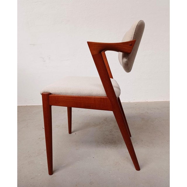 Fully Restored Customizable Kai Kristiansen Model 42 Teak Dining Chairs with swivel backrest in excellent condition with...