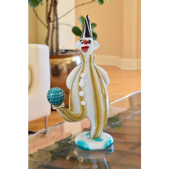 ITALIAN MURANO CLOWN GLASS DECANTER WITH STOPPER Era: 1980s Style: Art Glass Decorative Figure OVERVIEW: A charming hand-...