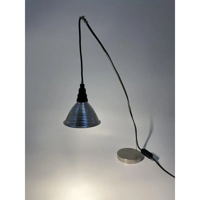 A table lamp *Model: "Grasl Vulgaris" *by Jan Roth *for Ingo Maurer lamps *Germany, 1973 *solid metal base with a flexible...