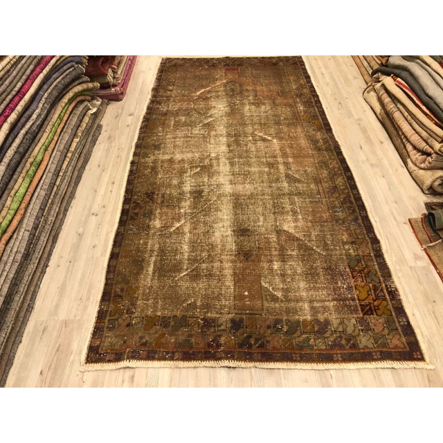 This is a vintage Turkish Oushak rug from the 1960s. The piece was hand-knotted.