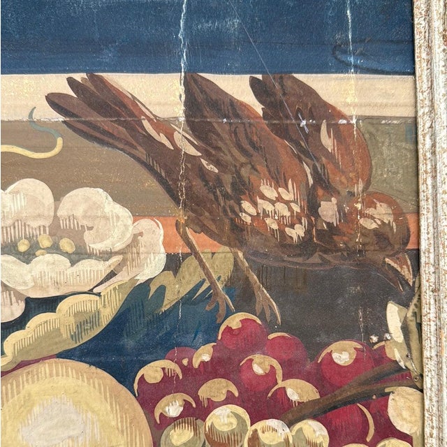 Framed French hand painted wallpaper panel with a fruit and floral motif. Painted white wood frame. 24”w x 2”d x 20”h 42-121