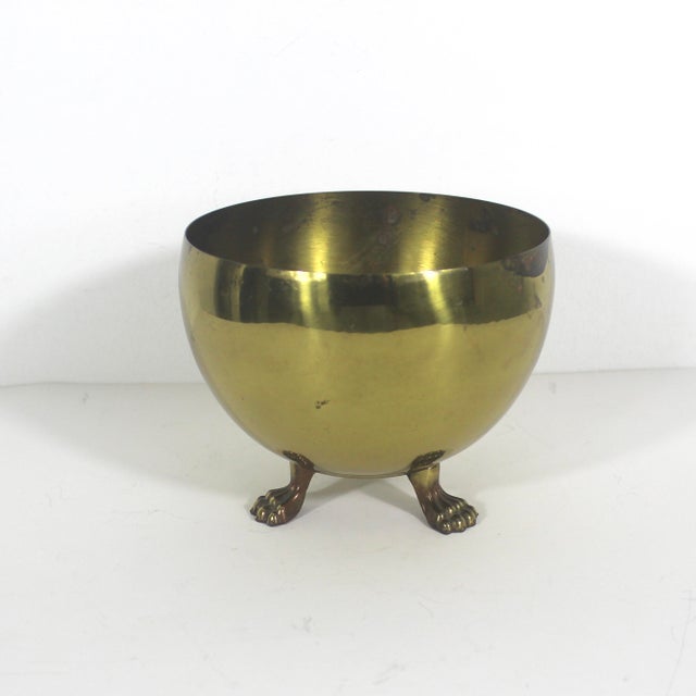 Vintage brass claw footed planter. This has spots and small dents and scratches and corrosion on the inside, and outside...