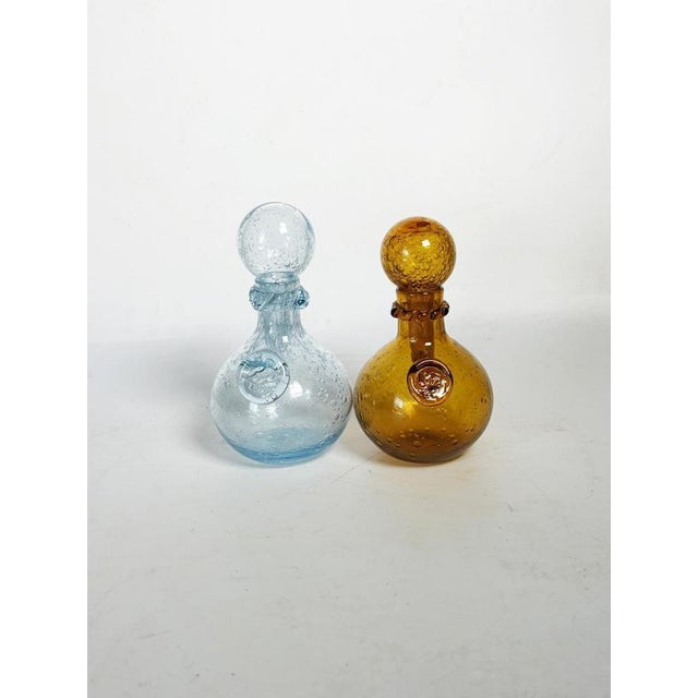 Pair of decorative blown glass bottles from Biot, made in France in the 1970s. These iconic pieces are distinguished by...