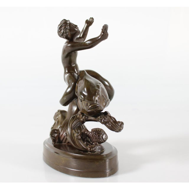 Original figurine designed by Danish artist and sculptor Just Andersen (1884-1943) featuring a young boy on a large fish,...