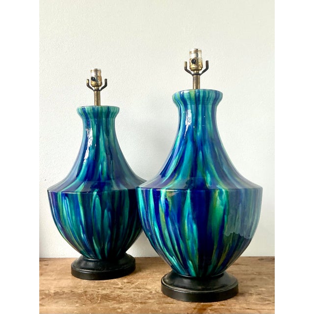 This striking pair of Mid-Century Modern table lamps showcases the vibrant, organic beauty of 1960s artisanal pottery....