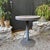 20th century brutalist cafe table with concrete top and steel base. Suitable for outdoor use.