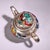 This is an ornate, silver-plated copper teapot or wine ewer featuring vibrant enamel (cloisonné-style) decoration. The...