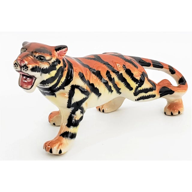 Offering a dynamic SMALL vintage porcelain growling Tiger figurine styled in an aggressive attack position, circa 1960s....