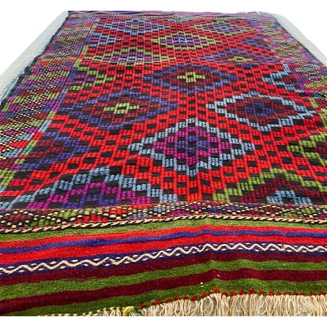 This exceptional mid-century Anatolian kilim presents a sophisticated geometric composition, where ancestral weaving...