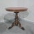 A rare Victorian walnut and burr walnut swivel top library table with inset red leather, in excellent overall condition....