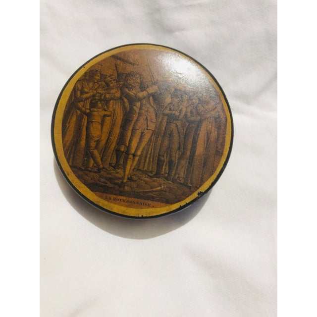 Late 18th - early 19th century French papier-mache patch box with engraved figural circular panel. . Panel depicts fiddler...