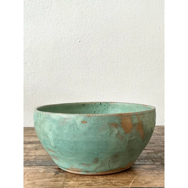 Exude a sense of organic tranquility with this exceptional vintage studio pottery bowl. A masterclass in artisanal...