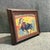 Petite framed Mid-Century Modern abstract acrylic painting depicting a matador clashing with a bull in the ring. The...