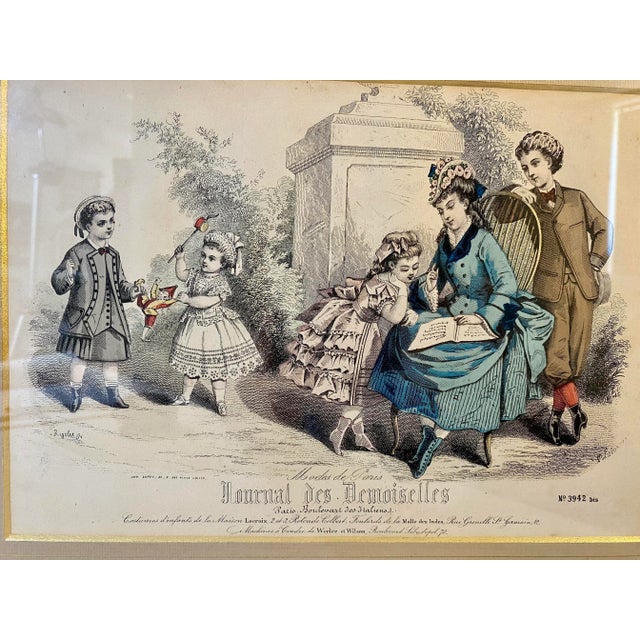Antique Hand Colored French Fashion Engraving - Circa 1879. Frame Measures 15” W x 12 1/4 T” x 1/2” D, Engraving Measures...