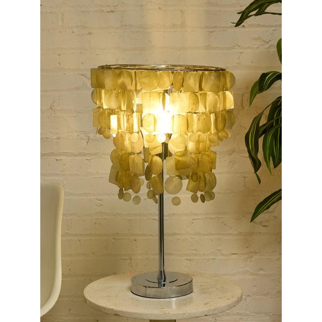 A wildly sculptural table lamp with a strong Verner Panton–inspired 1970s look, featuring cascading translucent shell...