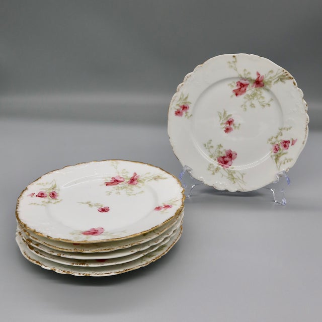 A lovely set of six antique dessert plates by C. Ahrenfeldt, one of the most respected names in Limoges porcelain. Made in...