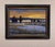 This oil painting captures a tranquil landscape at dusk, where the sky transitions into a warm palette of oranges and...