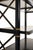 Black Empire Etagere with gold accents and case lighting. The item is not marked or signed.