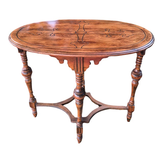 Bring classic architectural charm to your home with this stunning antique Victorian-style oval parlor table. Perfect for...