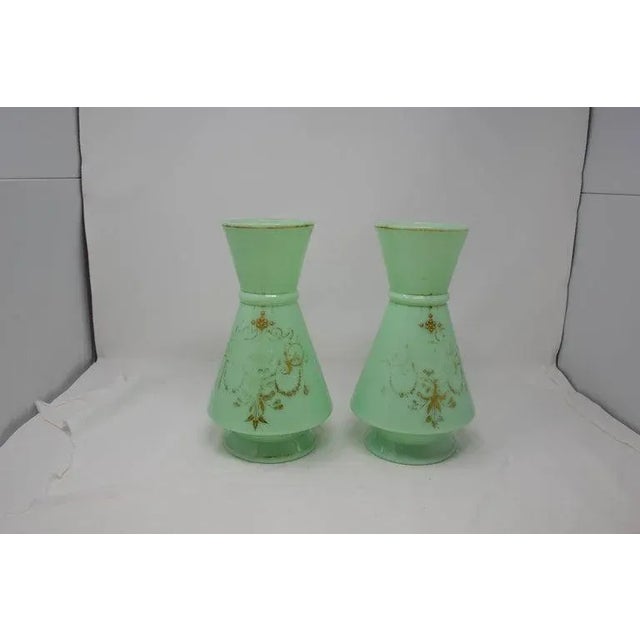 Opaline green glass set of 2. From France. Beautiful pair to use as a stand alone decoration or in the traditional manner...