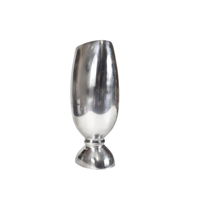 Beautiful aluminum pedestal vase will enhance your home decor. It is in great condition may have some mark and wear...