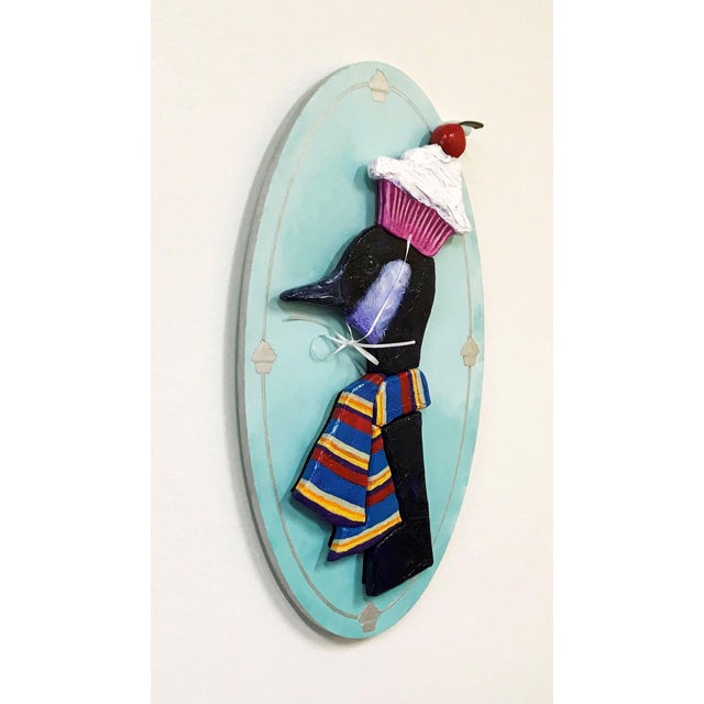Figurative Frederick and His New Hat by Corina St. Martin | Acrylic and Modeling Paste on Birch Black bird wearing a hat and scarf. For Sale - Image 3 of 4