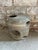 Vintage ceramic vessel with a speckled grey / brown glaze and circular cut out openings throughout. This German Mid-...