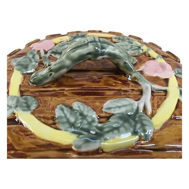 Antique majolica cylindrical cheese branch-handled dome and stand decorated in relief with trailing blossom on barrel-...