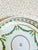 A refined porcelain low bowl by Royal Worcester, featuring a hand painted leaf swag motif. The soft ivory glaze and...