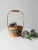 Experience the warmth of vintage with this beautiful balsa wood basket. Hand-painted winter pinecones give it a special...