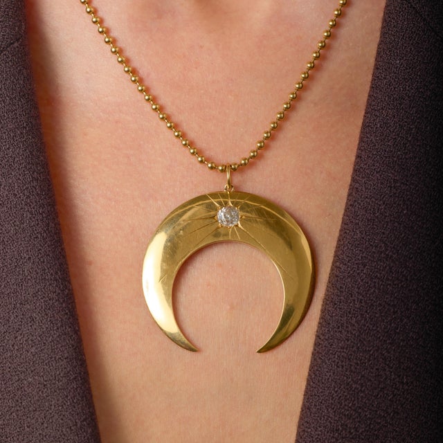 This evocative Victorian half-moon necklace is a striking example of turn-of-the-century symbolism and craftsmanship,...