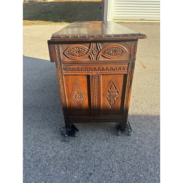 This piece showcases the bold architectural presence and rich detailing characteristic of the Jacobean tradition. The...