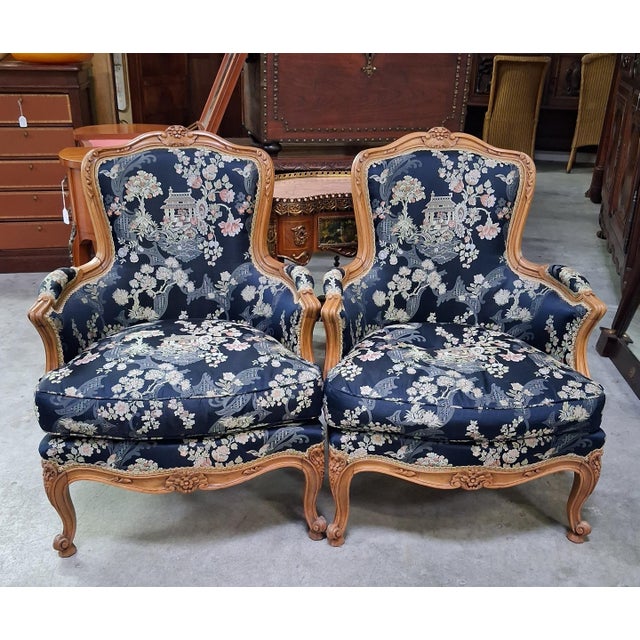Pair of louis xv style bergère armchairs with japonisme upholstery a charming pair of louis xv style bergère armchairs in...