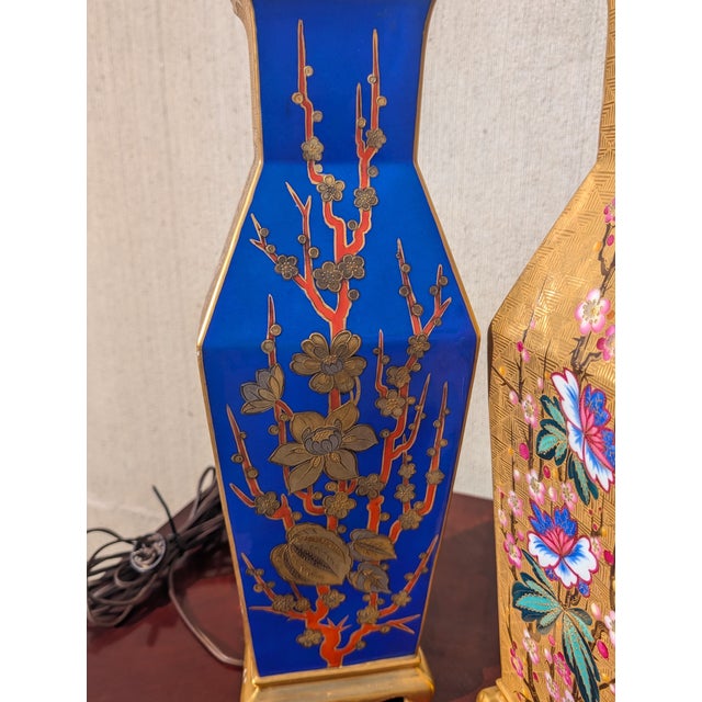 This exquisite pair of 19th-century Japanese cloisonné lamps features a deep, lustrous cobalt blue enamel ground,...