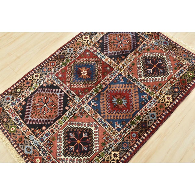 An authentic vintage tribal Yalameh rug hand-knotted with fine wool and natural dyes. This finely woven nomadic rug...