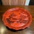 Detailed carving and a rich red color make this an attractive display plate. Flared rim with chased foliate pattern and on...