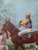 Heres a scene of a jockey leading a horse to race that was created by May Midday Knauf (1927-2025)) of Saratoga Springs...