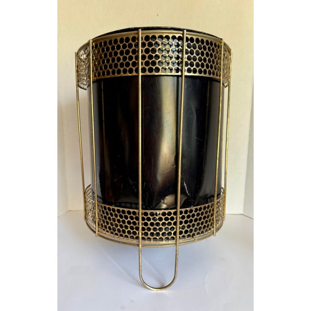Here is a wonderful mid-century modern metal wastebasket/trash bin. The piece is made from two pieces; An outer piece made...