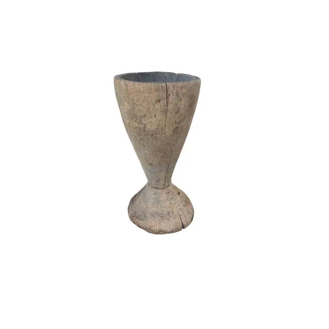 A vintage mortar bowl soured from rural Java & crafted from a solid teak wood slab. A raw and organic object with...